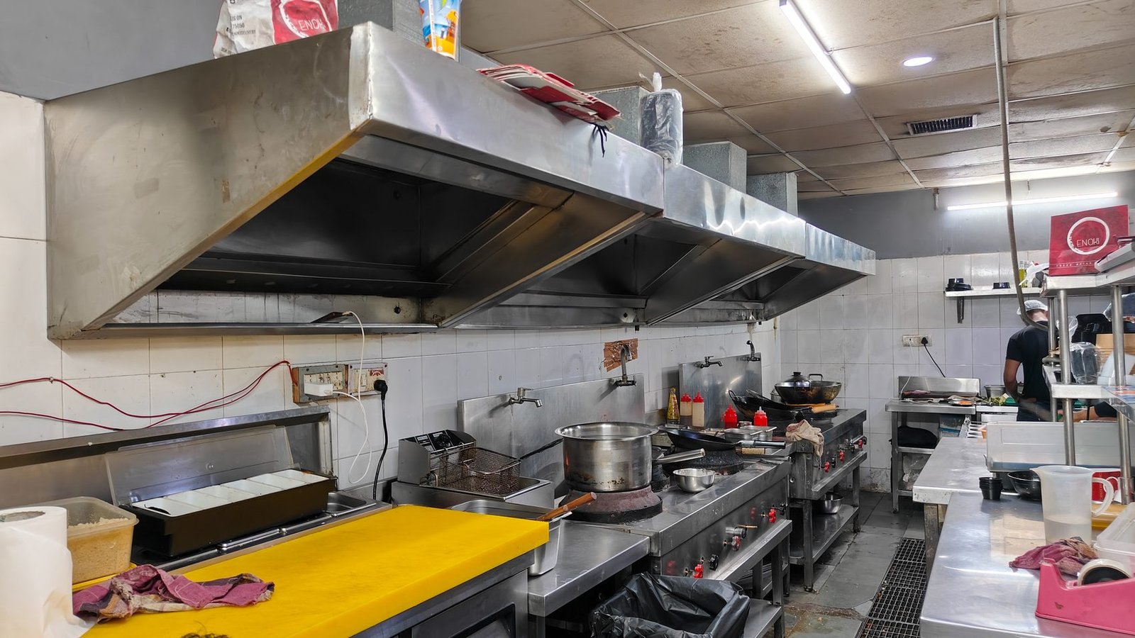 Fully-equipped Blue Wings cloud kitchen with commercial chimney hood and stainless steel stations